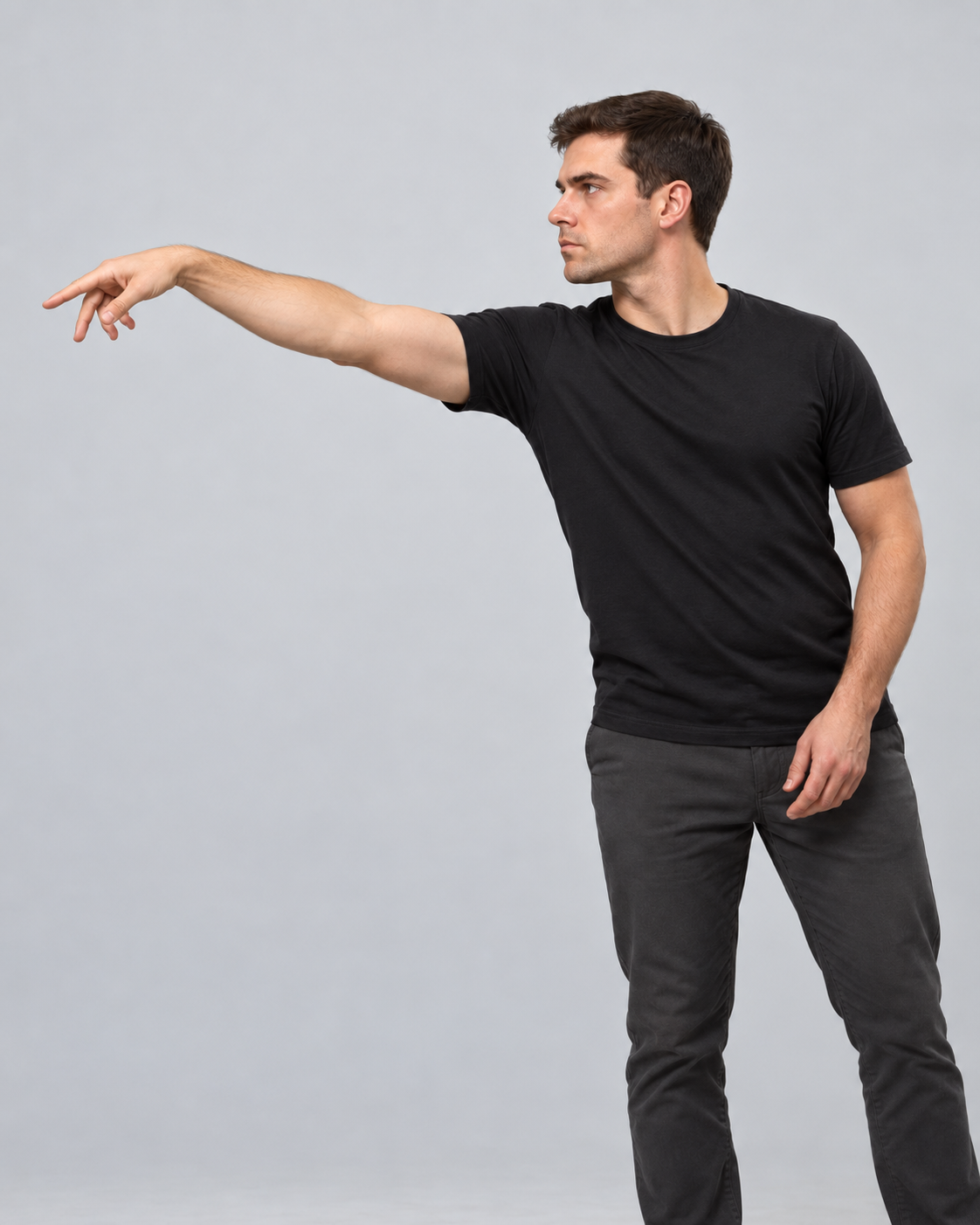 A darts player finishing the throw with an extended arm and relaxed hand and wrist.